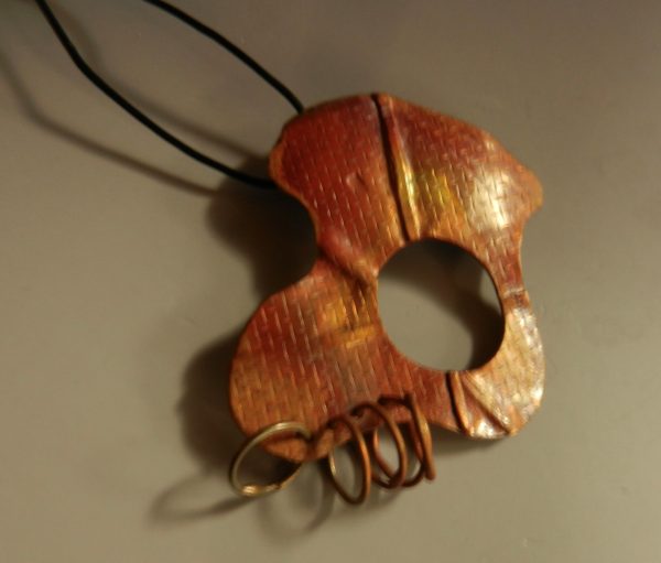 Free-formed, fold formed and textured copper pendant