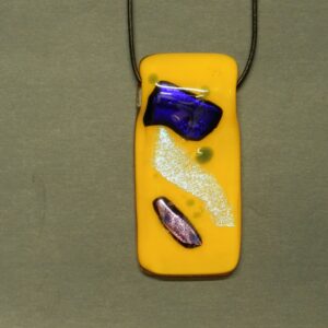 Goldish yellow dichroic glass pendant with Prussian blue and pink