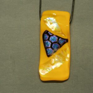 Orangy Yellow dichroic glass pendant with multi-colored accent hexagons